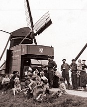 Salvation Army van serving soldiers coffee beside a windmill