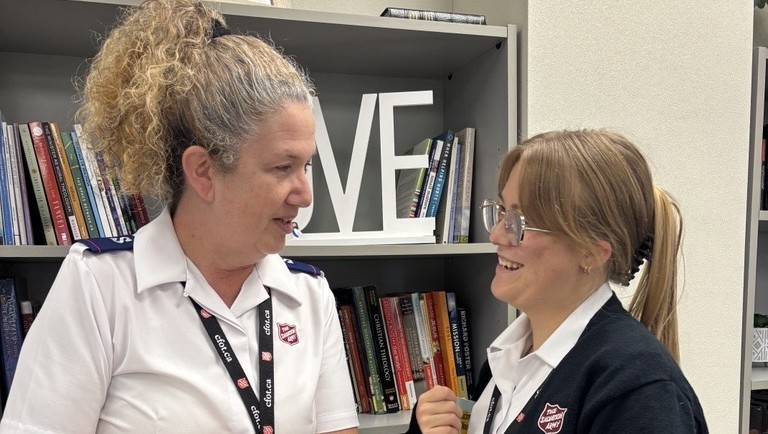 Image of two cadets smiling
