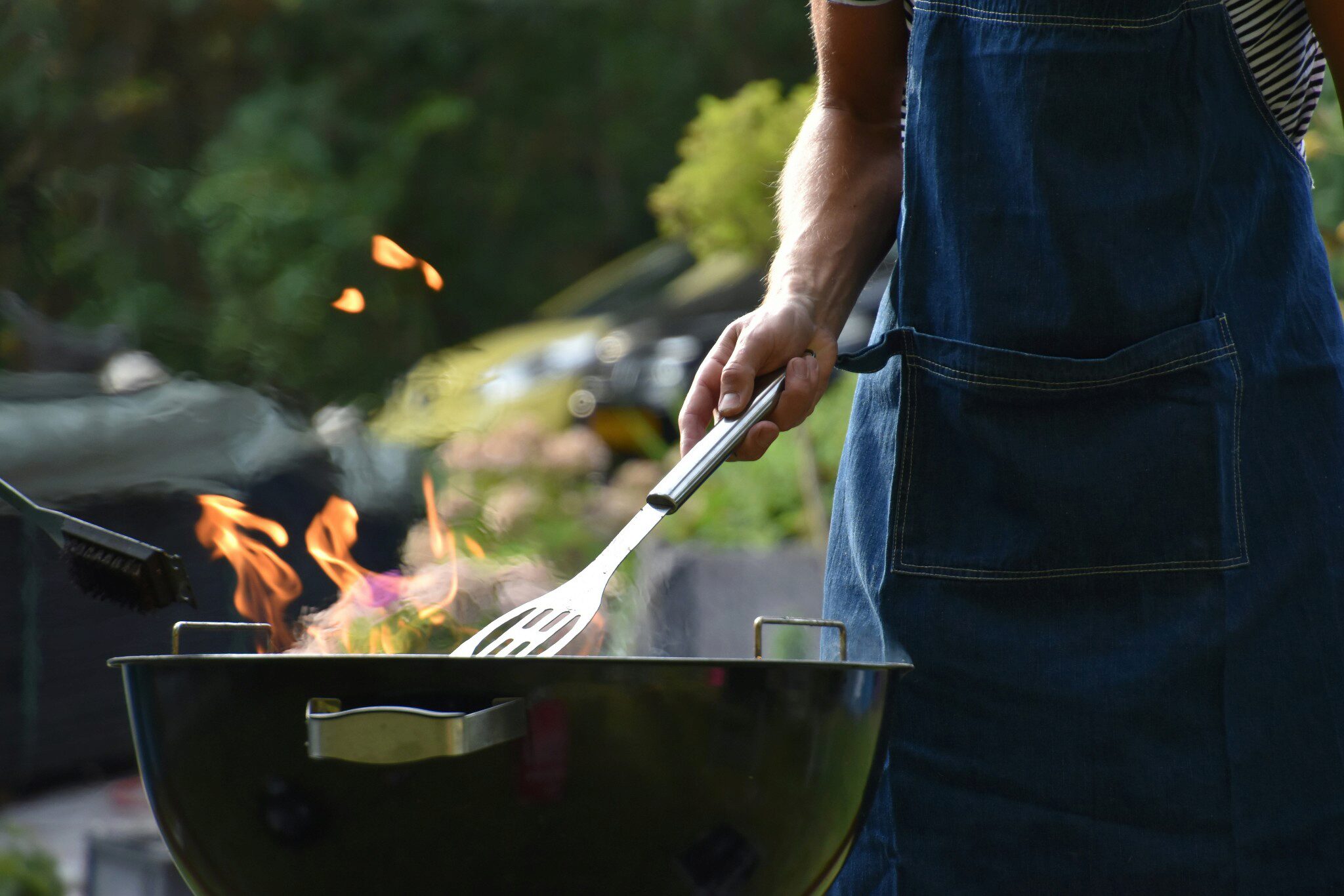 Person grilling on a BBQ