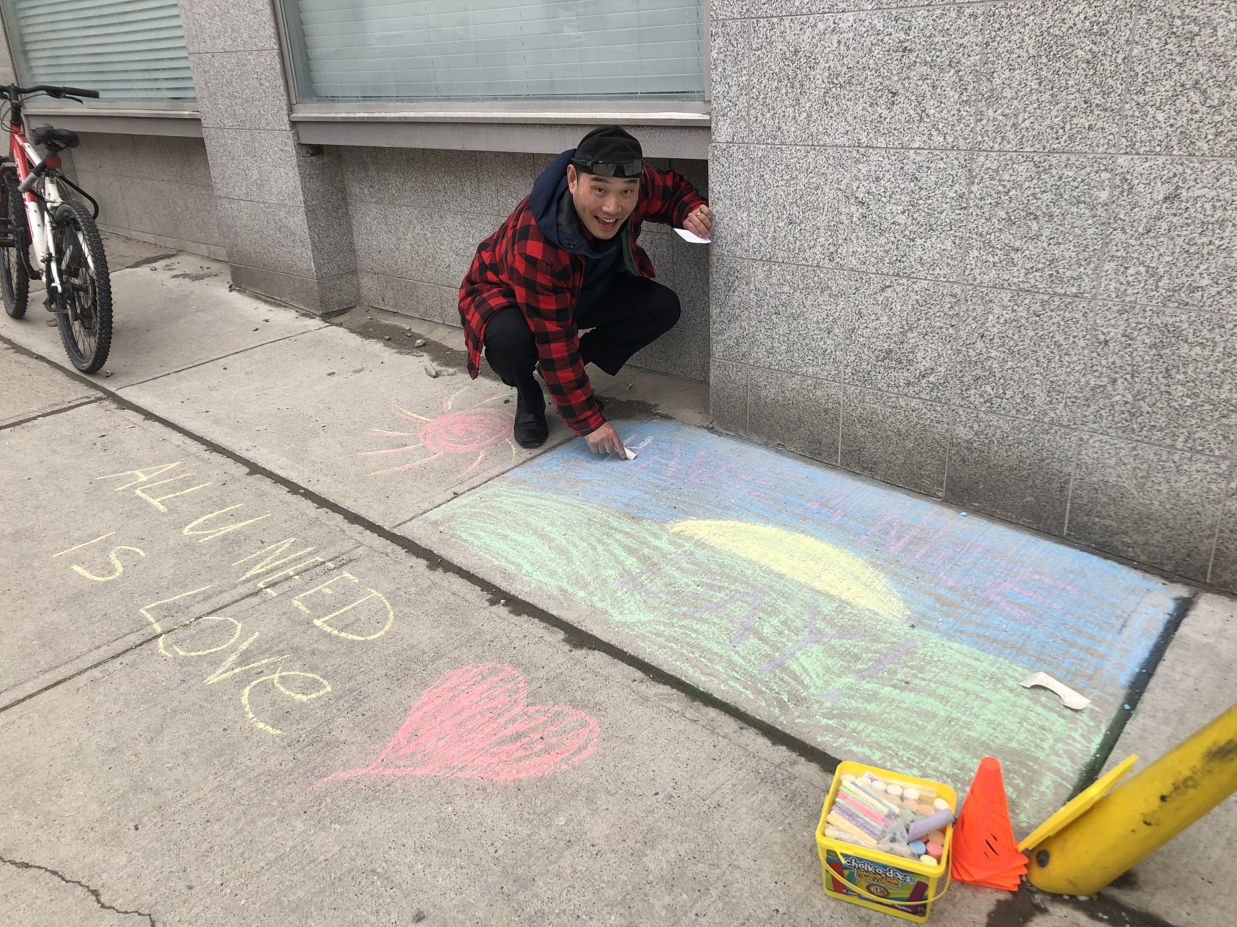 Captain Peter Kim uses sidewalk chalk as a tool to engage community.
