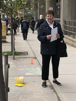 Lt. Colonel Jean Moulton engages community members through street outreach.