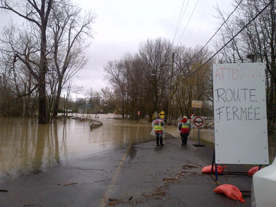 Severe flooding closes a road in Rigaud, Que.