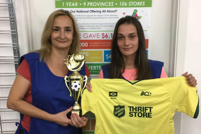 Salvation Army thrift store employees proudly display a Bloor Central Soccer Club jersey