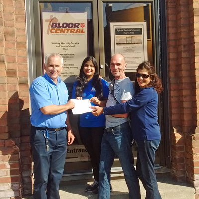 Bloor Street Soccer Club presents a cheque to Major Doug Hammond