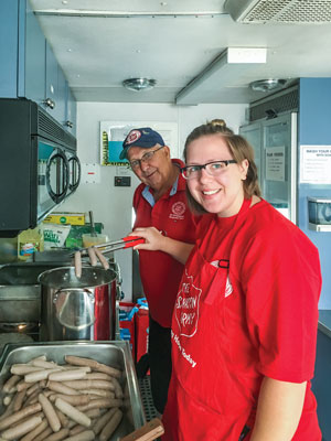 From left, Jen Wolfe and Jade Ganje are ready to serve food in Williams Lake