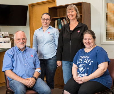 Sherry Glenn (right) and her family are graduates of Pathway of Hope, thanks to help from Donald Halsey, Melanie LeBlanc and Alison Moore