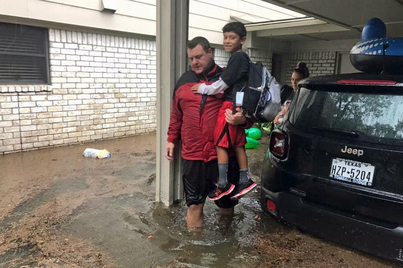 Captain Jay Ward rescues a family from the floods