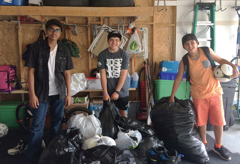 Santhosh Rajmohan, Kostas Skanderis and Navid Aimaq sort out the community donations
