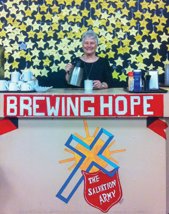 Carol Fode serves coffee at the Army’s Community Resource Centre in Medicine Hat, Alta.