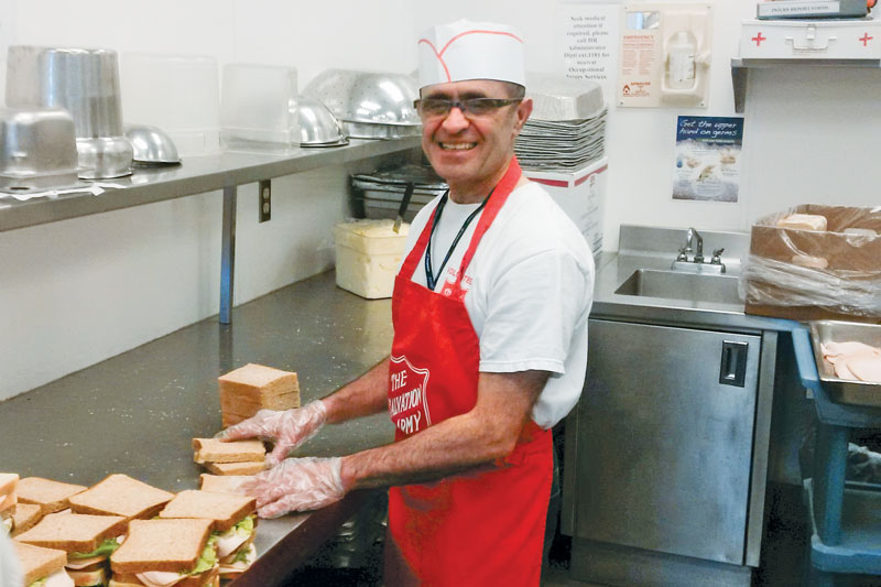 Mahmoud Haghtajdar enjoys helping others as he serves in the kitchen at Calgary's Centre of Hope
