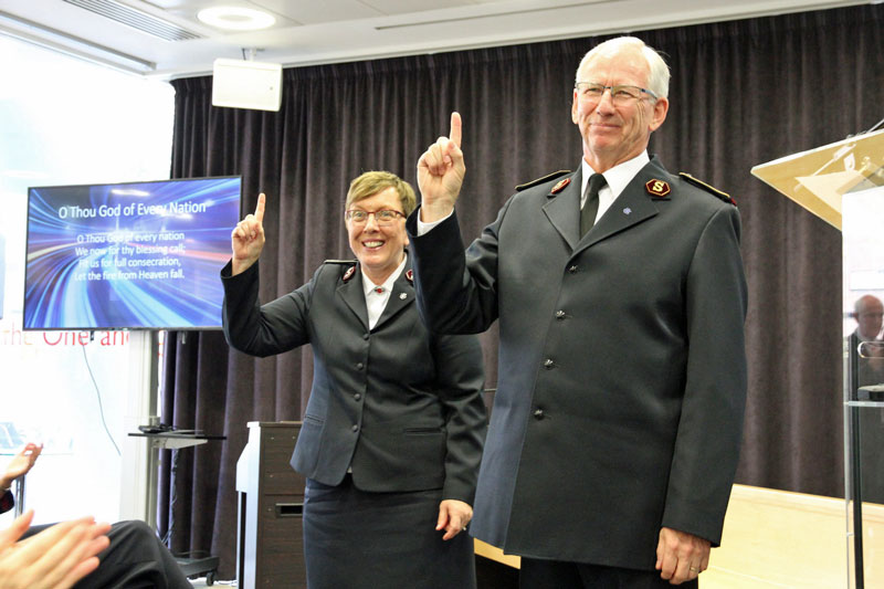 General Brian Peddle and Commissioner Rosalie Peddle take the salute