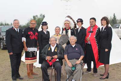 Photo of Commissioner Susan McMillan and members of cabinet with Indigenous leaders