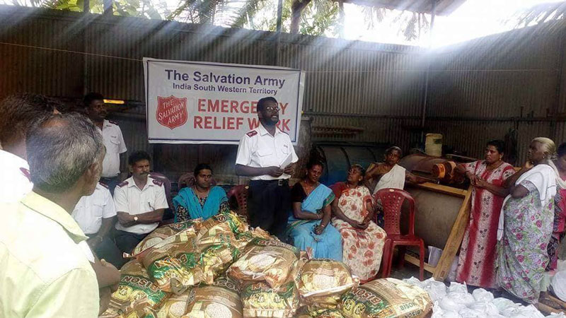 Officers distribute emergency food supplies