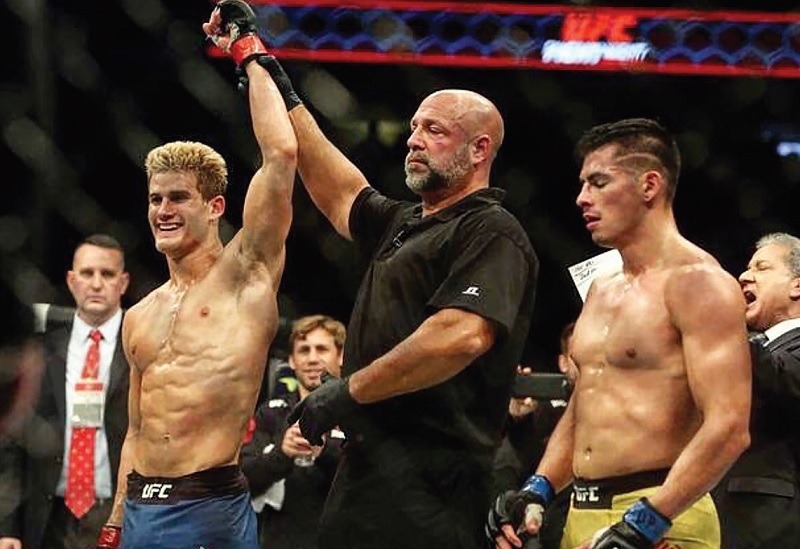 Sage Northcutt, hand raised in victory after another successful bout