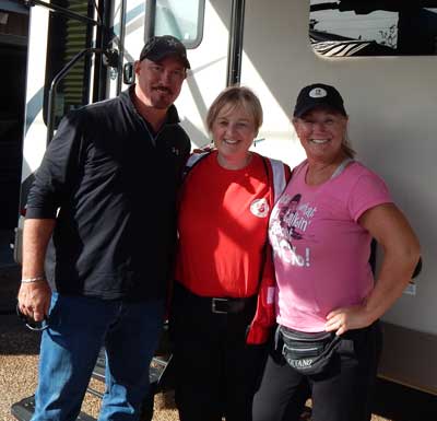 Photo of Linda Leigh with hurricane victims Rick and Sherri