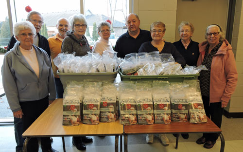 Community care ministries members and volunteers pose with Sunshine Bags