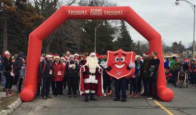 Photo of Santa and Shieldy at start of run