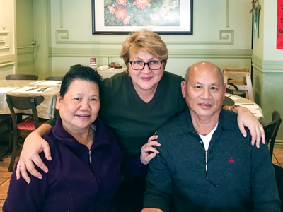 Sieng and Man with Carmen Bejancu, manager of the Army’s recycling centre in Ottawa, at Sieng’s retirement luncheon in October 2017