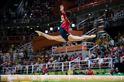 Laurie in action as an artistic gymnast