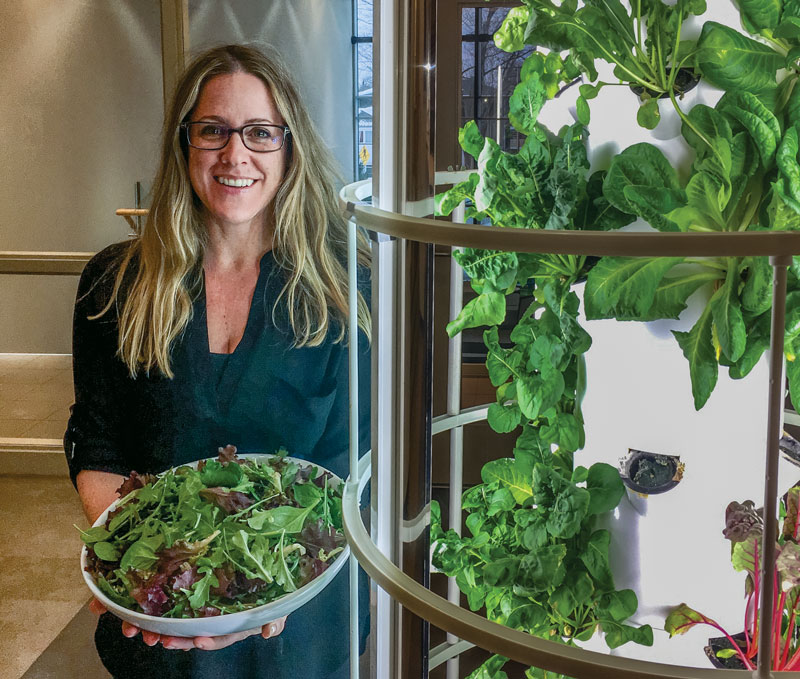 Dennise Yarema holds fresh lettuce picked from the tower garden at Bethany Hope Centre in Ottawa
