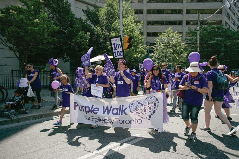 Tom Nesbitt and his mother, Judy, march in the Purple Walk for Epilepsy Toronto