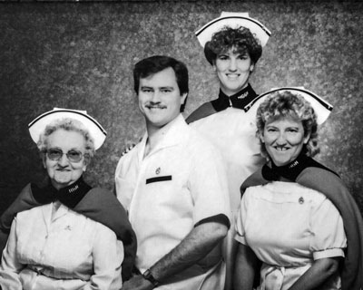 The family posed together with Mrs. Brg Ada Oakley in the early 1990s for this group photo