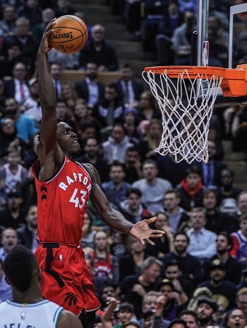 Pascal puts the ball in the basket during a game