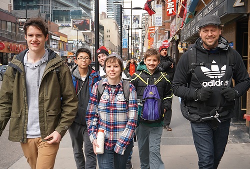 Youth pastor Matt Delaney walks with part of the youth group around the streets of downtown Toronto