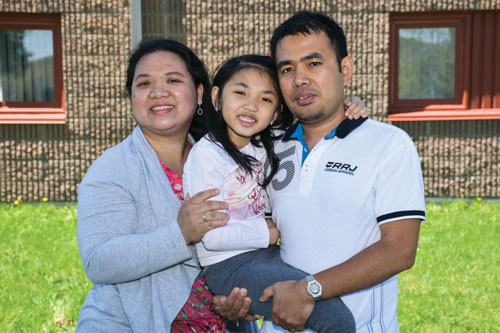 “We’re so thankful that the Army embraced us with open arms,” says Eleanor Tiam, with her husband, Armando, and their daughter, Alisha