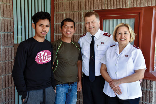 “We were looking for a church, and with this church, our prayers were answered,” says Leonardo Arogante, with his son, Jessie, and Mjrs Angel Sandoval-Silva and Marlene Sandoval