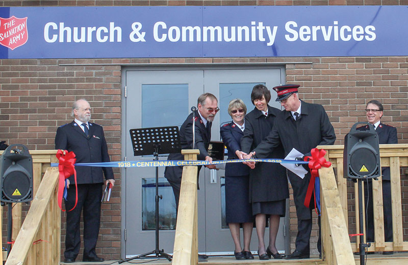 Cpts Ben and Isobel Lippers; Mjr Margaret McLeod; and Lt-Col Fred Waters, TSBA, cut the ribbon