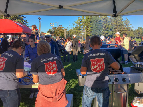 Salvationists serve food at a park in Barrhaven