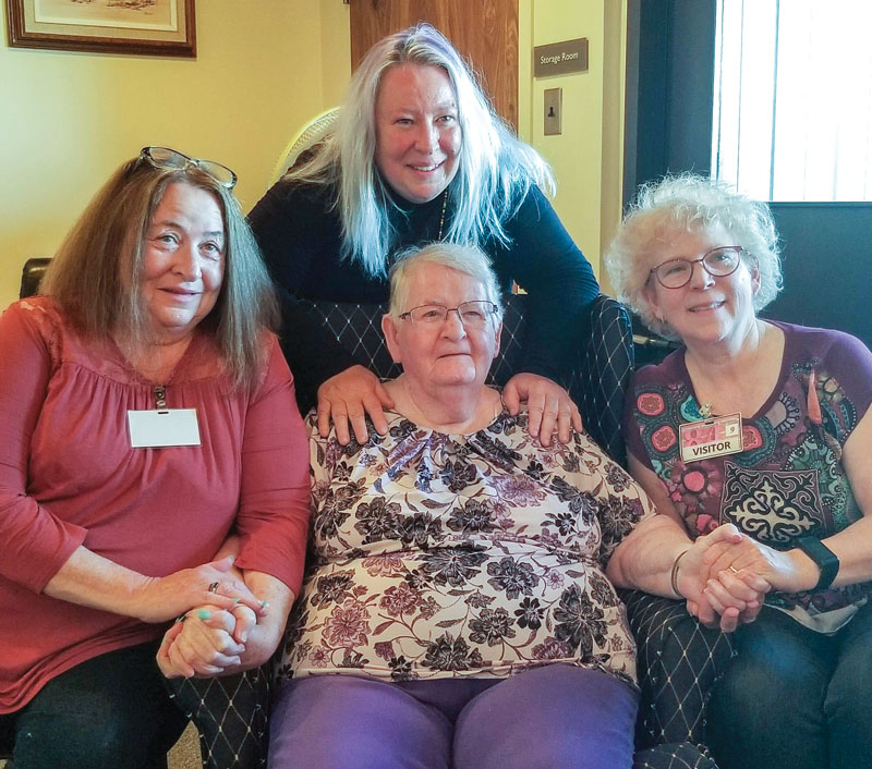 Mjr Joan Smith (seated, centre), with her sisters, from left, Robyn, Penny and Wendy