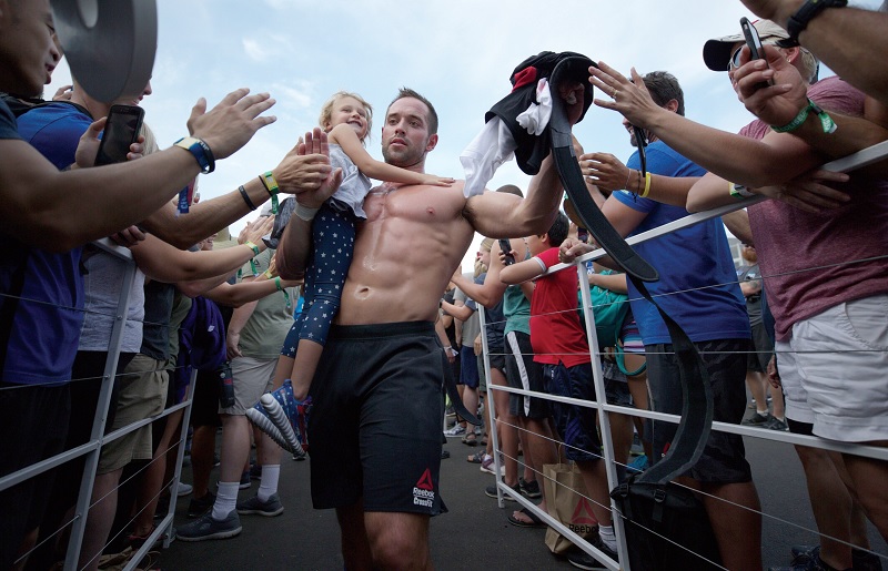 Rich Froning Jr. celebrates another CrossFit win with his fans and his daughter (Photos: Dre Strohm)