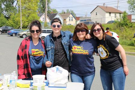 A group of four block party volunteers