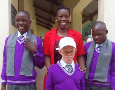 Photo of Elizabeth Ngare with students
