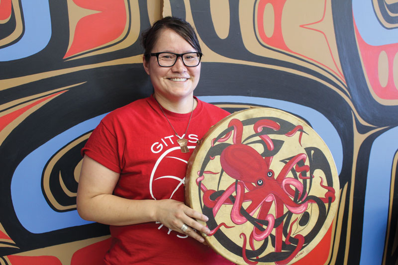 Michelle Stoney holds a drum she painted (Photo: Kristin Ostensen)