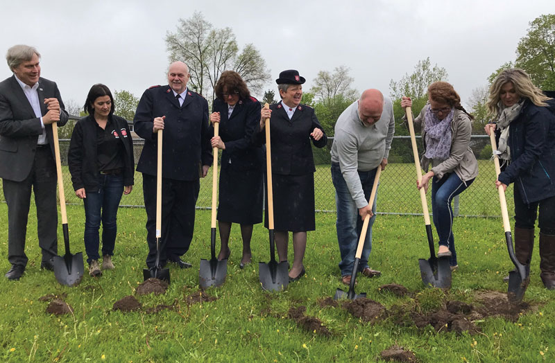 Representatives from The Salvation Army and Redwood Park Communities turn sod at the ceremony