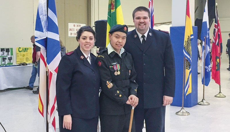 Cpts Melissa and Brent Haas with Philip, now a chef in the Canadian military 