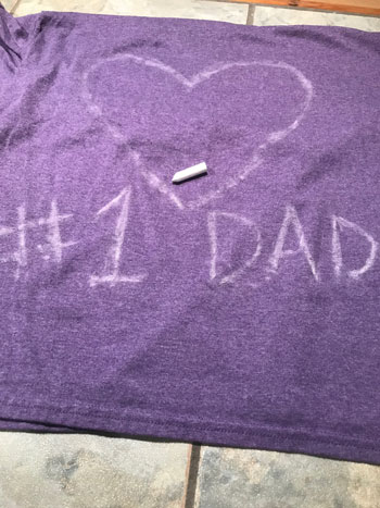 Purple T-shirt with heart on drawn it