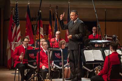 CSB Bandmaster John Lam gives the Army salute