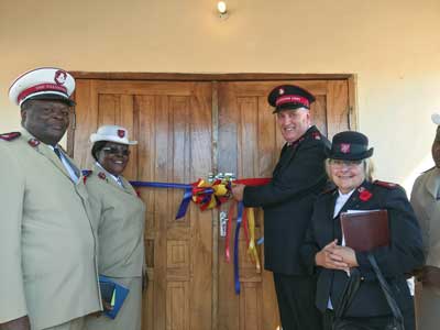 t, Cols Moses and Sarah Wandulu, TC and TPWM, Malawi Tty, and Mjrs Ron and Toni Cartmell, then DC and DDWM, Alta. & N.T. Div, cut the ribbon for the new corps in Monkey Bay, Malawi