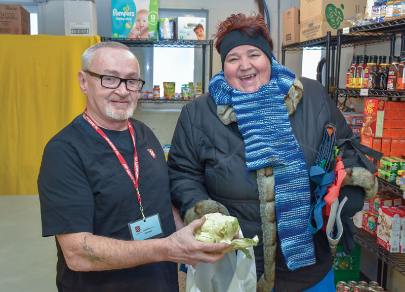 Glen Mattinson assists Crystal at the food bank at Cedarbrae Community Church