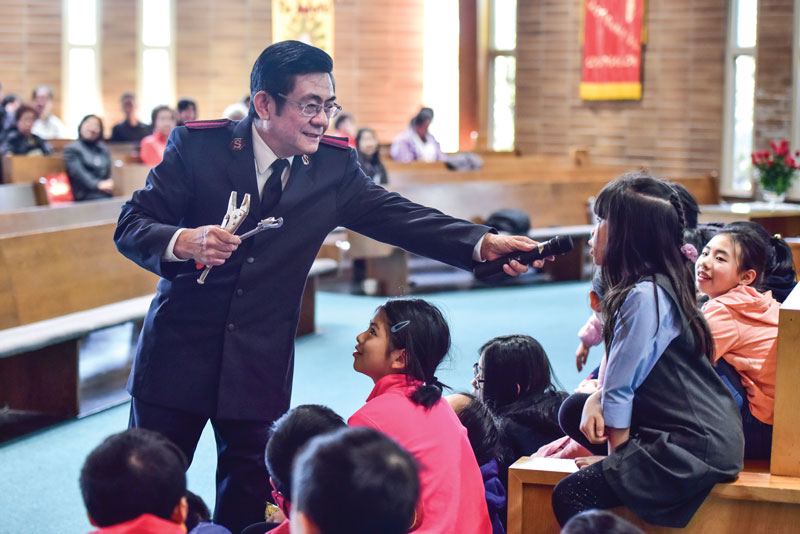 Aux-Cpt Parker Shieh leads an interactive children’s time during a Sunday morning meeting
