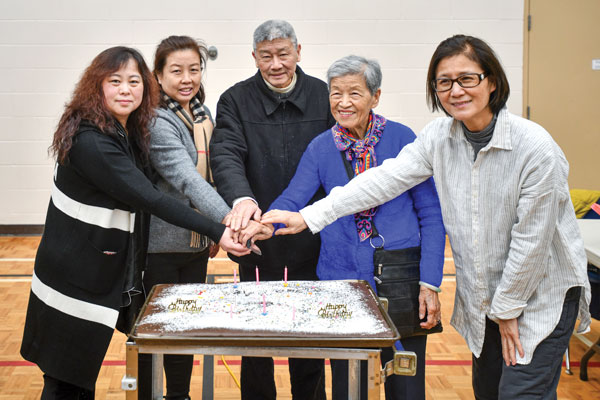 Church members cut a birthday cake