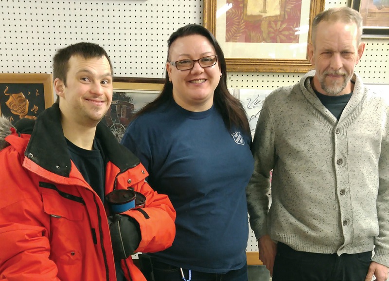 Kevin, Mark and Brenda Hornsby pose at a Salvation Army thrift store