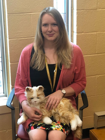 Nicole Butt holds a cat