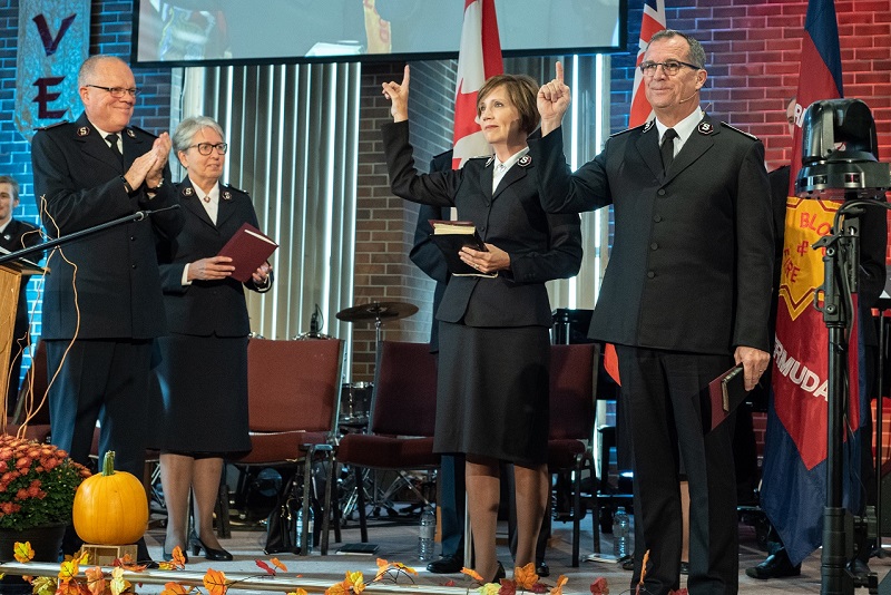 Commissioners Floyd and Tracey Tidd give the salute following their installation