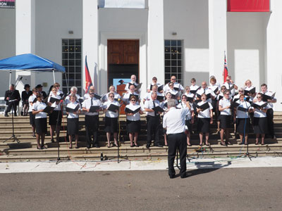 Canadian Staff Songsters sing on the steps of city hall