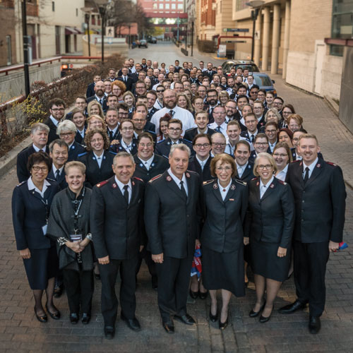 Large group photo with Salvation Army officers and Salvationists